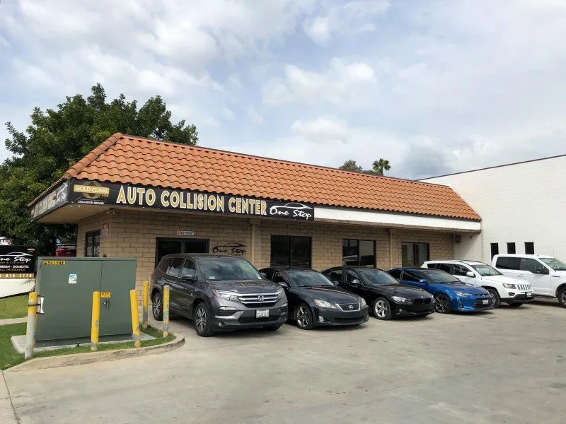 Customer cars parked outside the One Stop Auto Collision Center on N Grand Ave, Covina